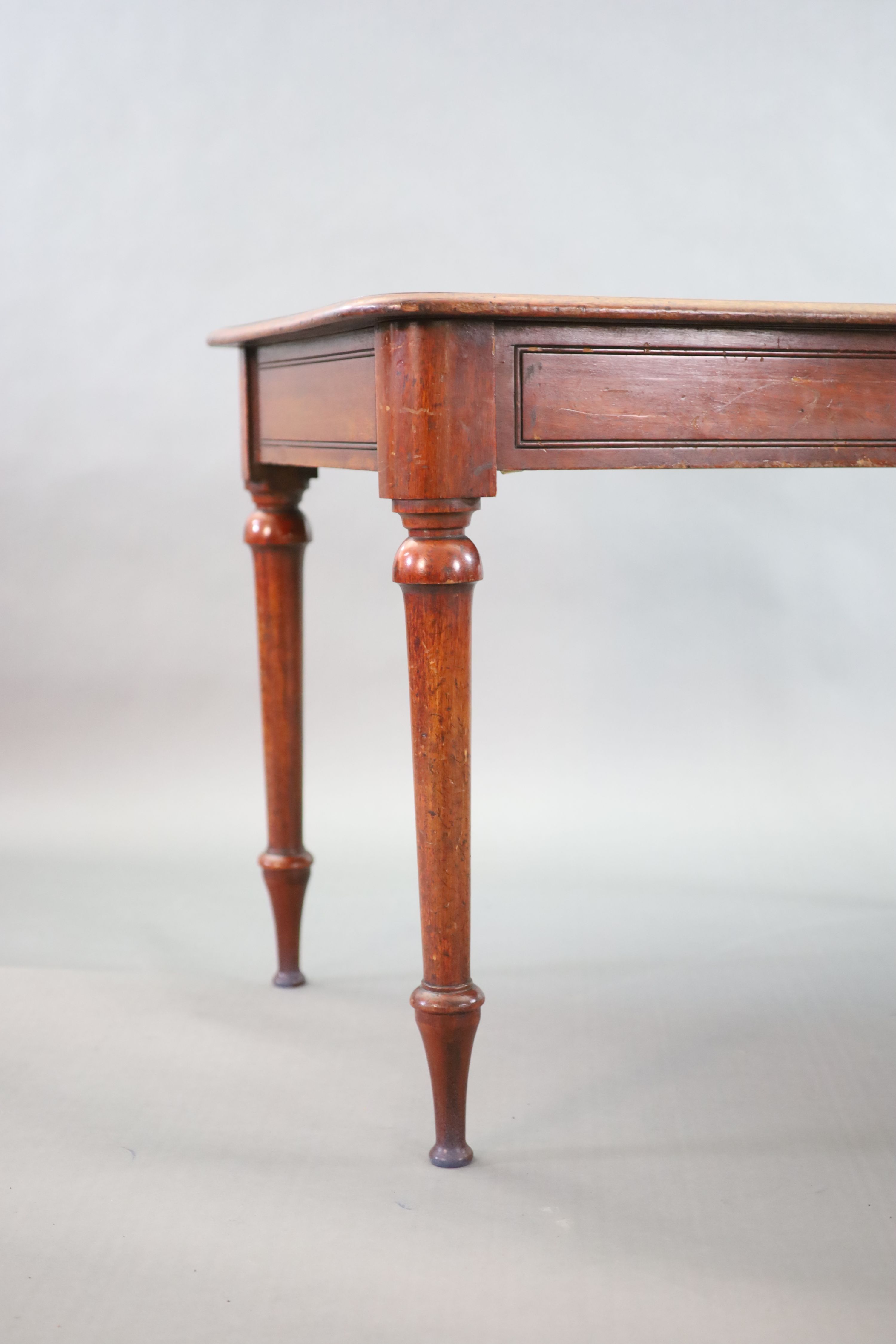 A Victorian mahogany writing table, W.114cm, D.69cm H.76cm